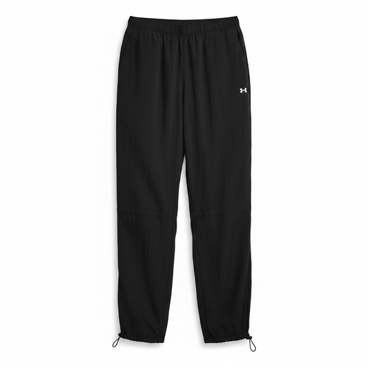 Under Armour Rival Woven Bungee Pant nera flat lay sfondo bianco